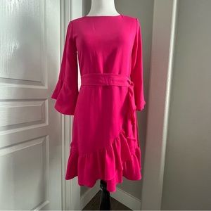 Girls Pink wrap dress with ruffle hem.